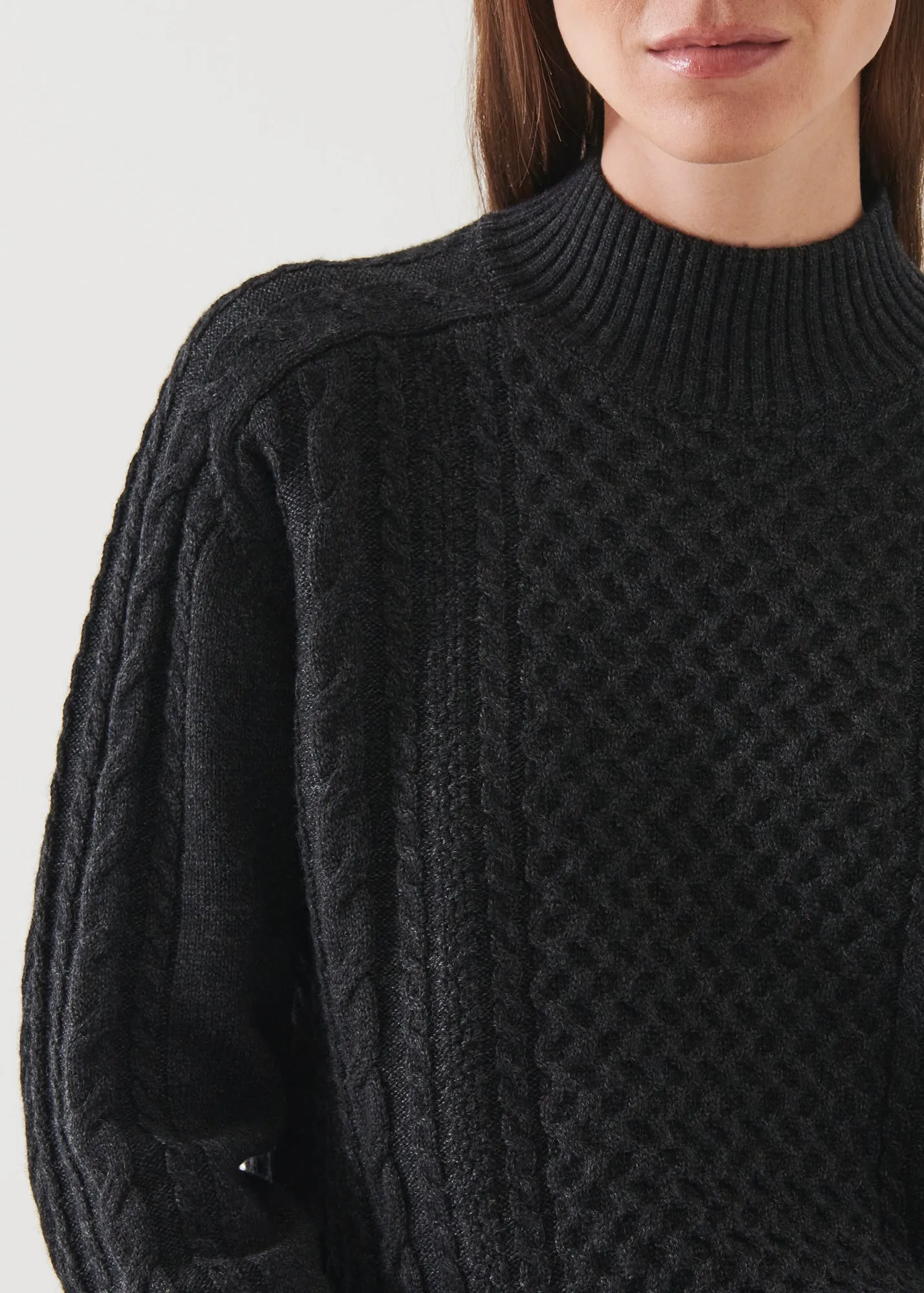 CABLE KNIT MOCK NECK SWEATER